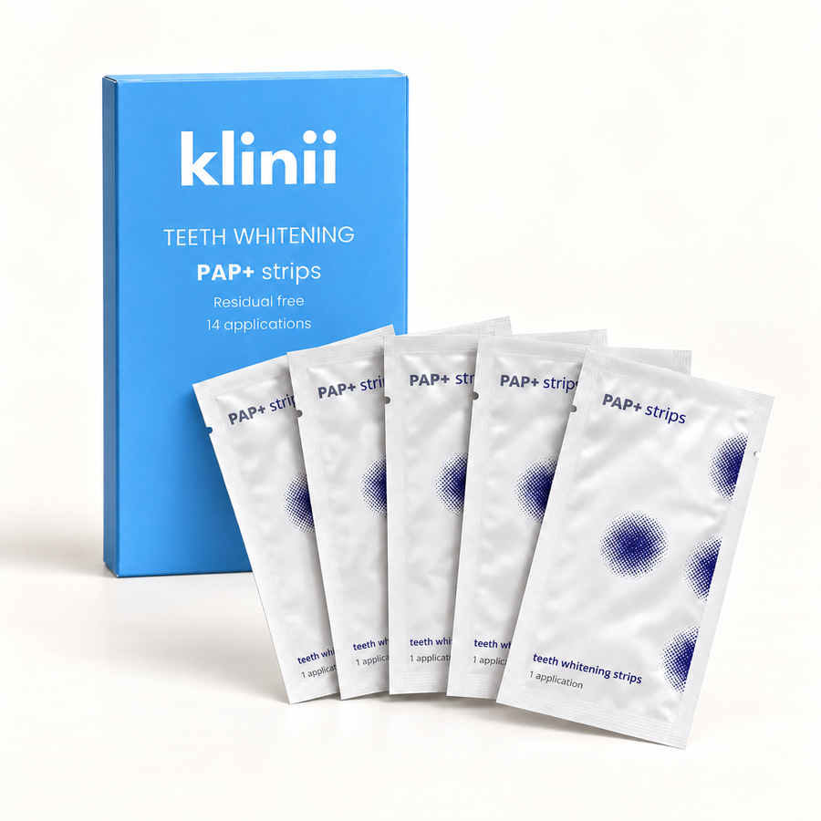 Klinii PAP+ teeth whitening strips box with five sachets on a soft white background
