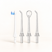 Klinii Water Flosser replacement heads on a soft white and ivory background