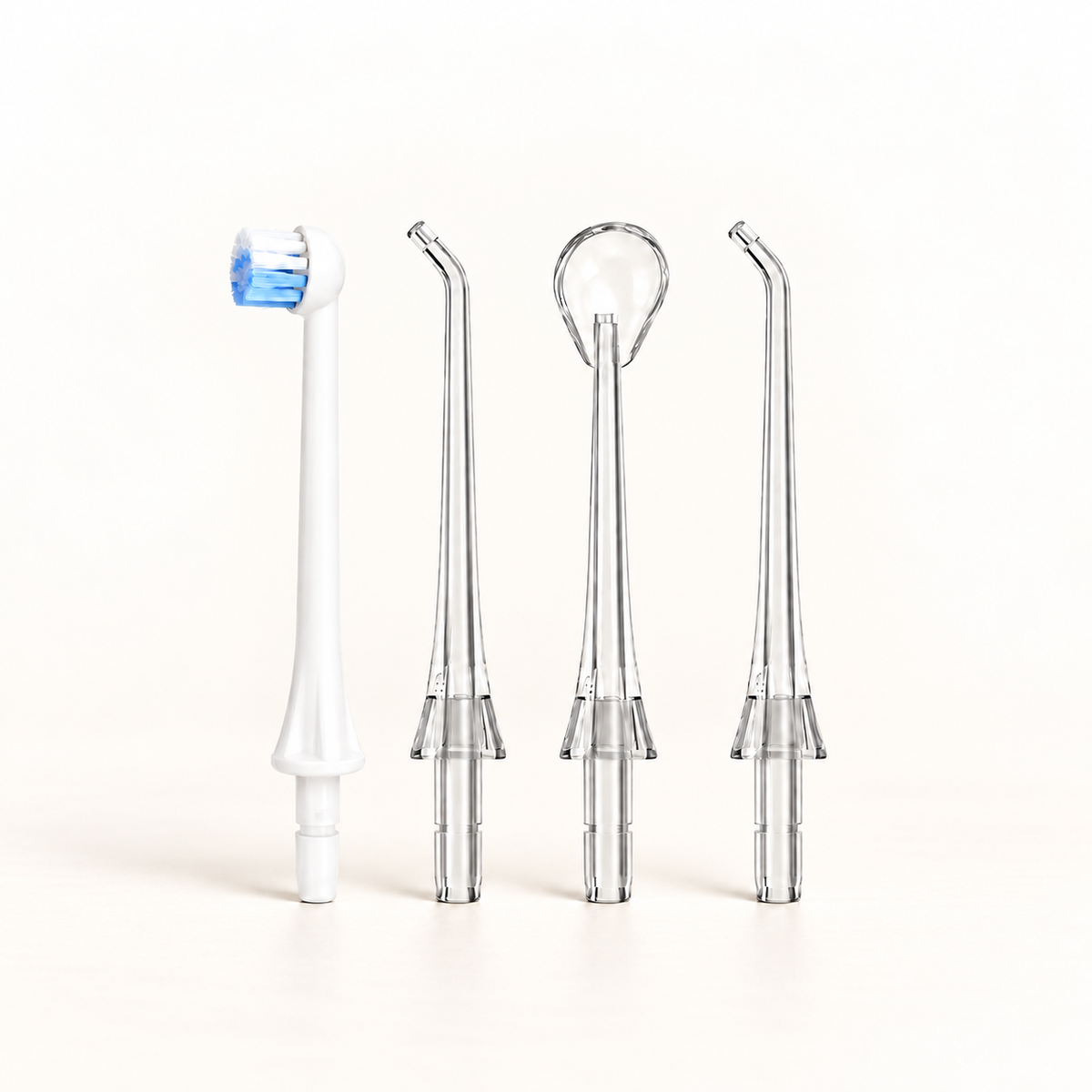 Klinii Water Flosser replacement heads on a soft white and ivory background